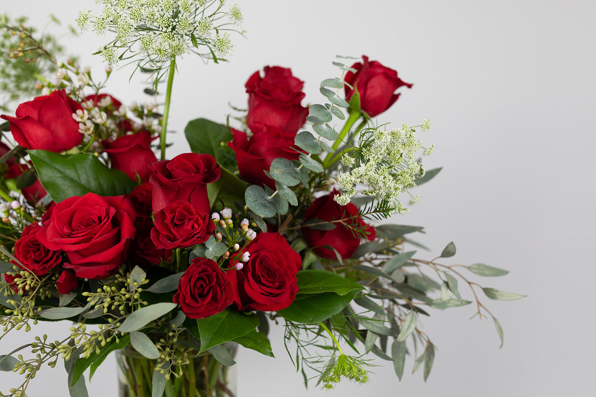 The lover is filled with extra-large red roses, red spray roses, queen anne&#39;s lace, and romantic eucalyptus greenery. Valentien&#39;s flower delivery available for same day delivery in the local Kansas City great metro area. Red rose arrangement for Valentine&#39;s Day. 