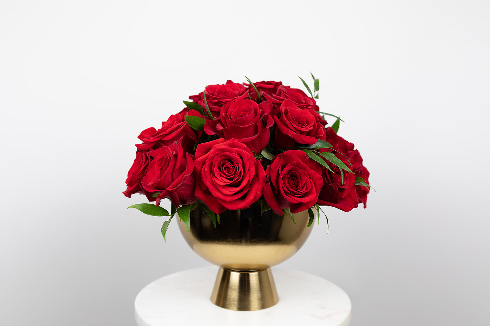 Red rose arrangement in gold compote. Red roses for Valentinne's Day. Delivery in local Kansas City Great Metropolitan Area. Same day delivery Valentine's Day arrangements. Glam arrangement.