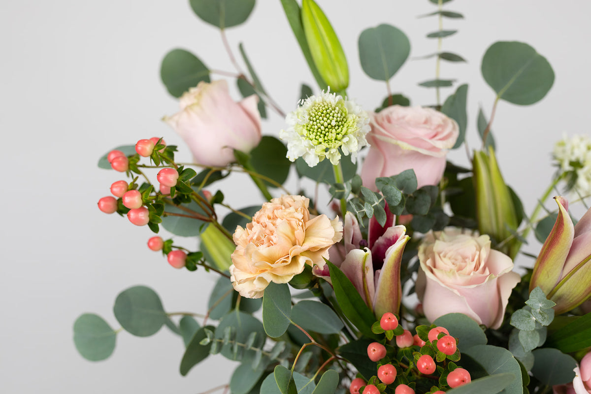 Stargazer lily and eucalyptus flower arrangement. Valentine&#39;s Day delivery ready to deliver to the local Kansas City Greater Metropolitan Area. Valnetine&#39;s day flowers in pink vase. Galentine&#39;s flowers.