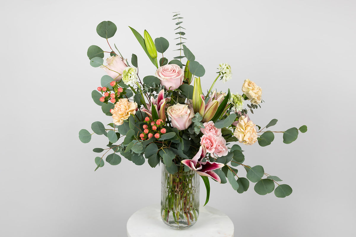 Stargazer lily and eucalyptus flower arrangement. Valentine&#39;s Day delivery ready to deliver to the local Kansas City Greater Metropolitan Area. Valnetine&#39;s day flowers in pink vase. Galentine&#39;s flowers.