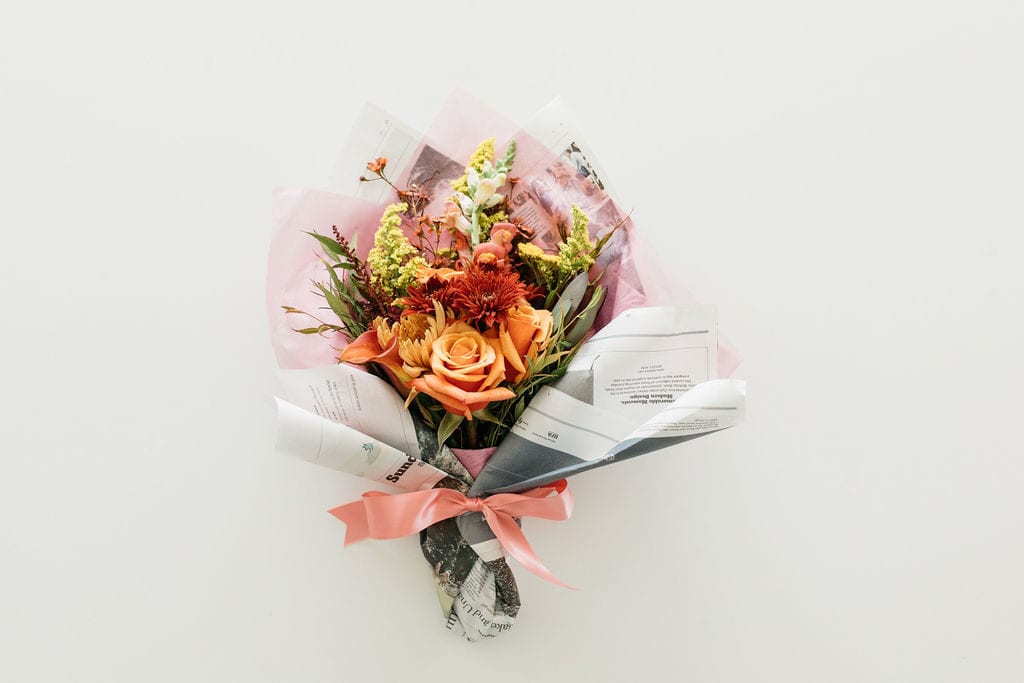 Small bouquet wrapped in newspaper